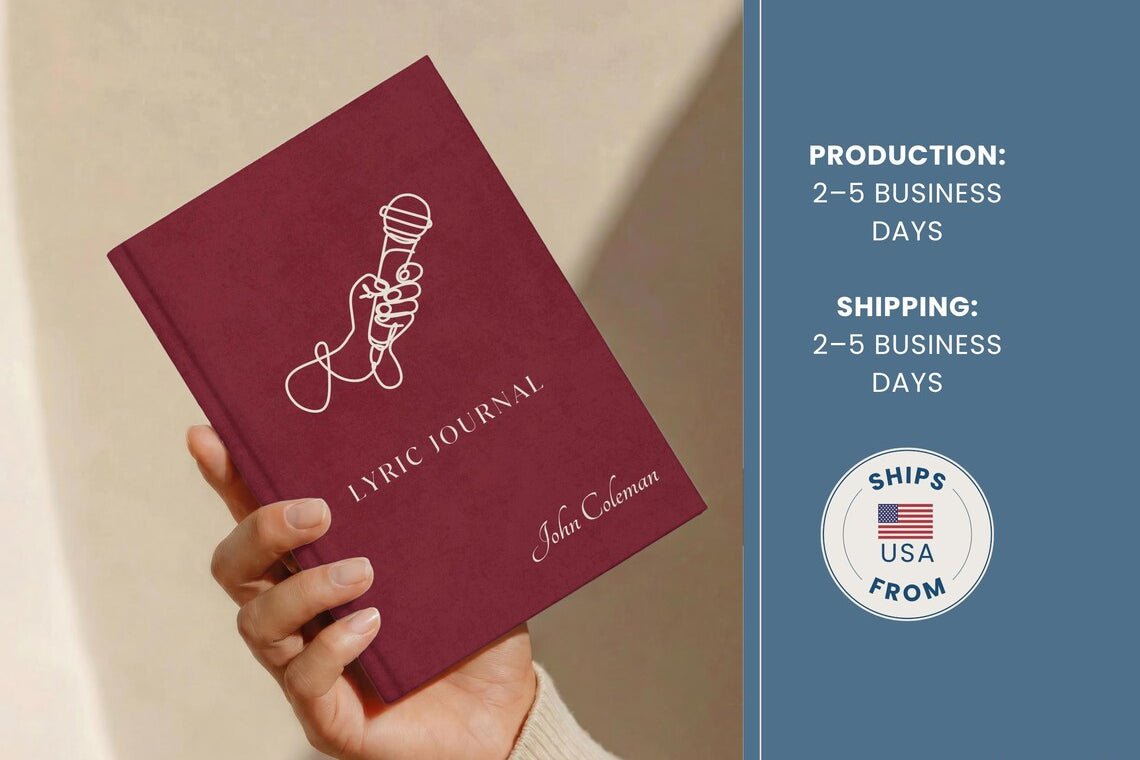 A hand holds a burgundy lyric journal with a white line drawing of a microphone and the text 'LYRIC JOURNAL' and 'John Caleman'. The right side of the image has a blue panel with shipping information and a 'Ships USA From' badge.