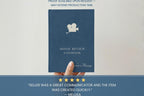 A navy blue hardcover book titled 'Movie Review Logbook' by author Melisa Massey, held by a hand against a light background. The cover features a white film camera icon and white text.