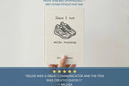 A hand holds a cream-colored book titled 'Ideas I had while running' by Olie Green, featuring a simple sketch of running shoes on the cover. The image includes a blue banner at the bottom with a testimonial quote and text stating 'Proof available upon request - May extend production time.