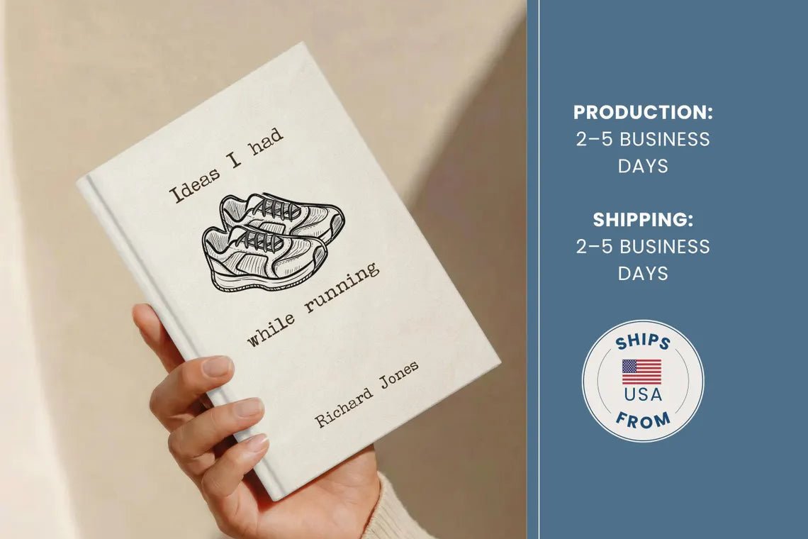 A hand holds a slim hardcover book titled "Ideas I had while running" by Richard Jones. The cover is off-white with a black line drawing of running shoes and black text.